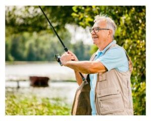 Older man fishing on a lake